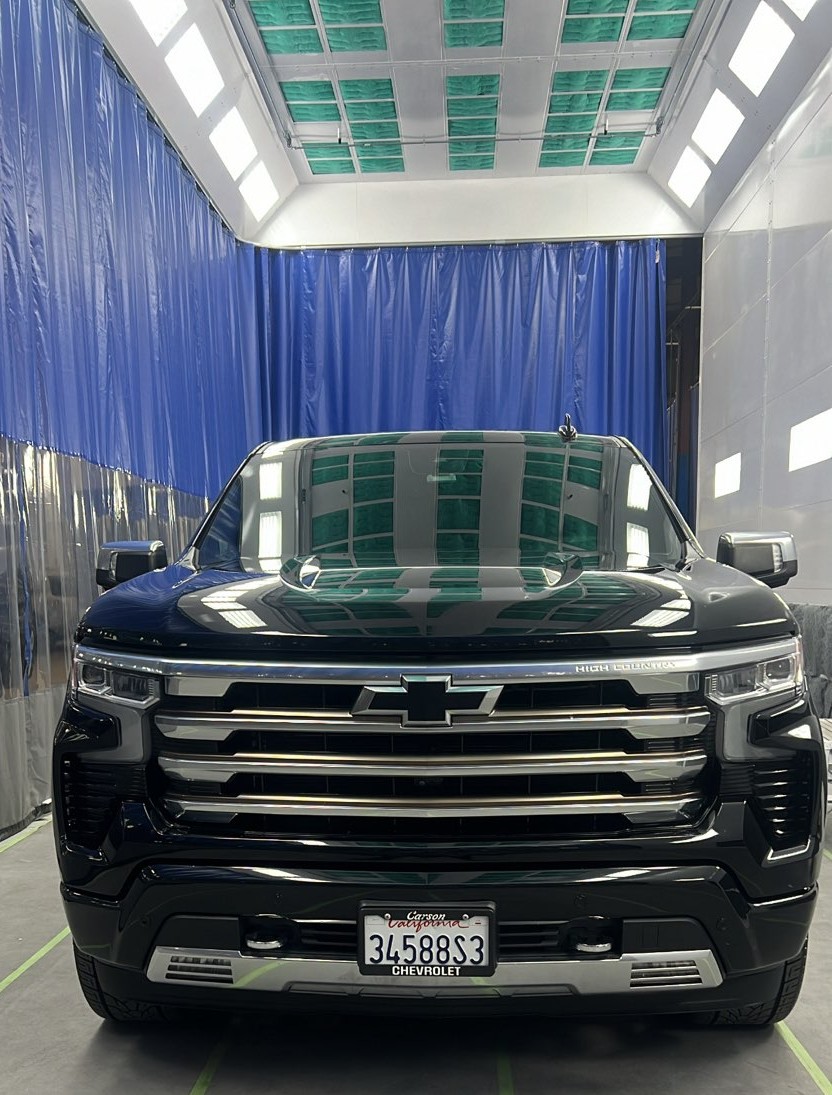 Chevrolet High Country pickup masked and refinished in the downdraft spray booth