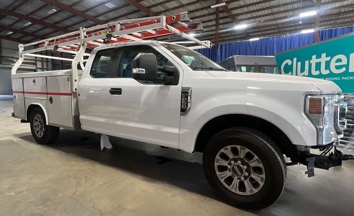 Refinished white Ford F-250 utility truck ready for pickup