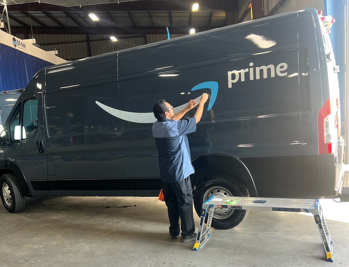 Amazon Prime delivery van being lettered and repaired at Key West