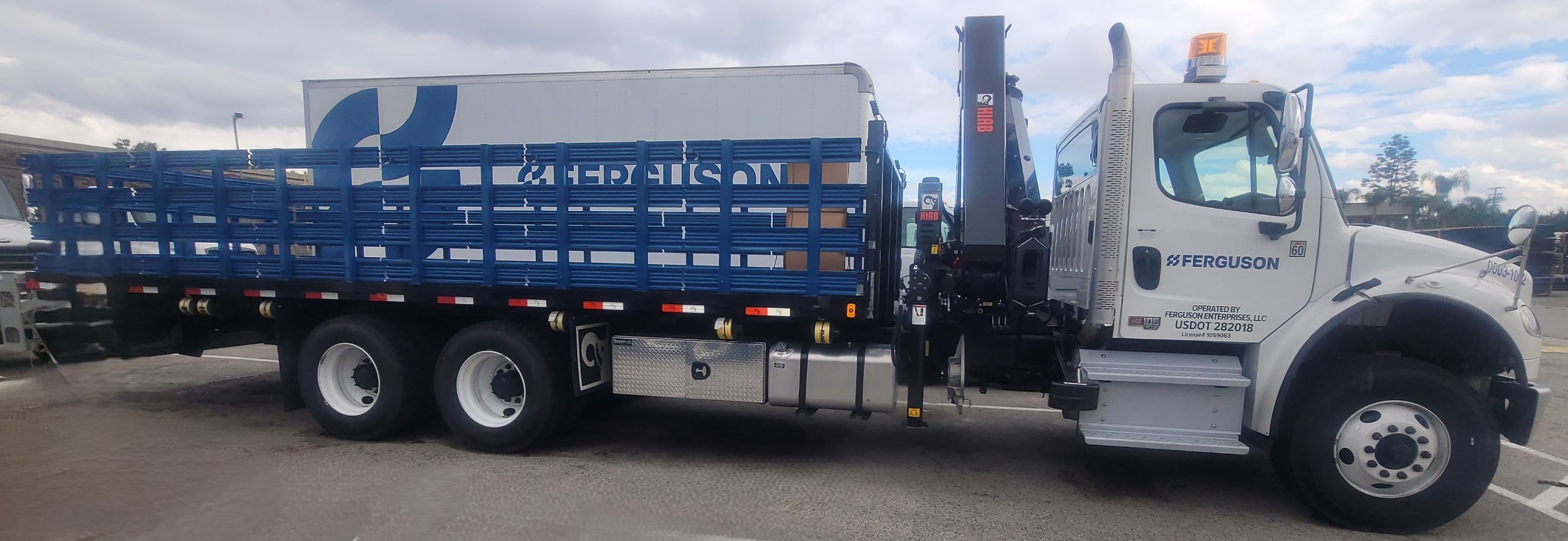 Ferguson Enterprises Freightliner stake-bed crane truck serviced at Key West