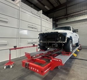 Pickup truck on the laser frame straightening rack