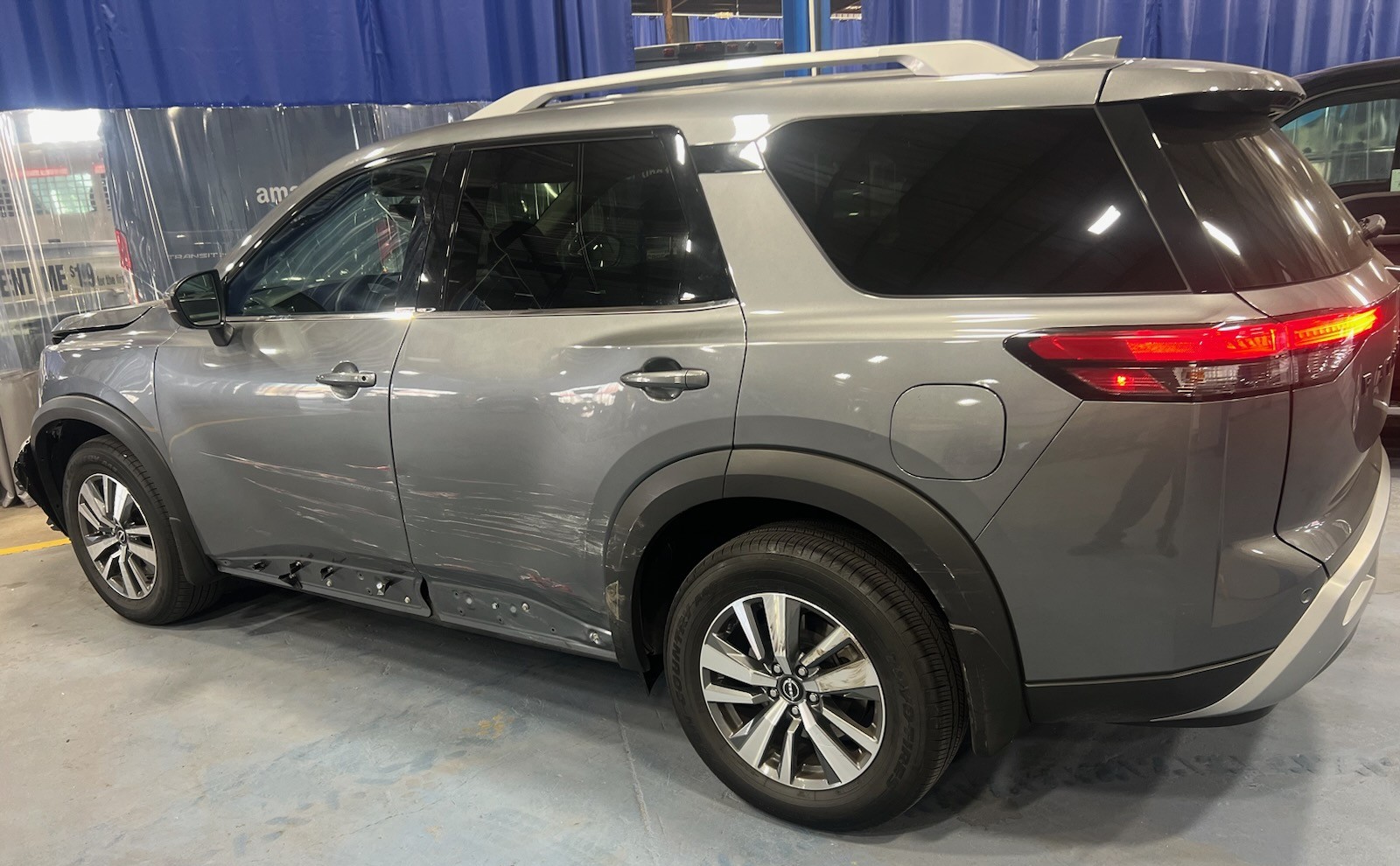 Nissan Pathfinder SUV in for collision repair at Key West