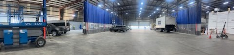 Wide interior view of the Key West Rancho Cucamonga collision shop floor