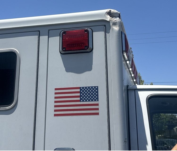 Damaged rear corner of an ambulance before repair